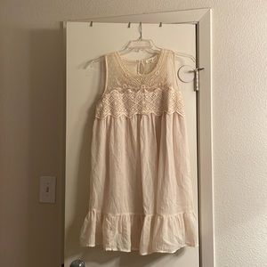 Sheer sleeveless cream colored dress with lace and mesh detail, size L